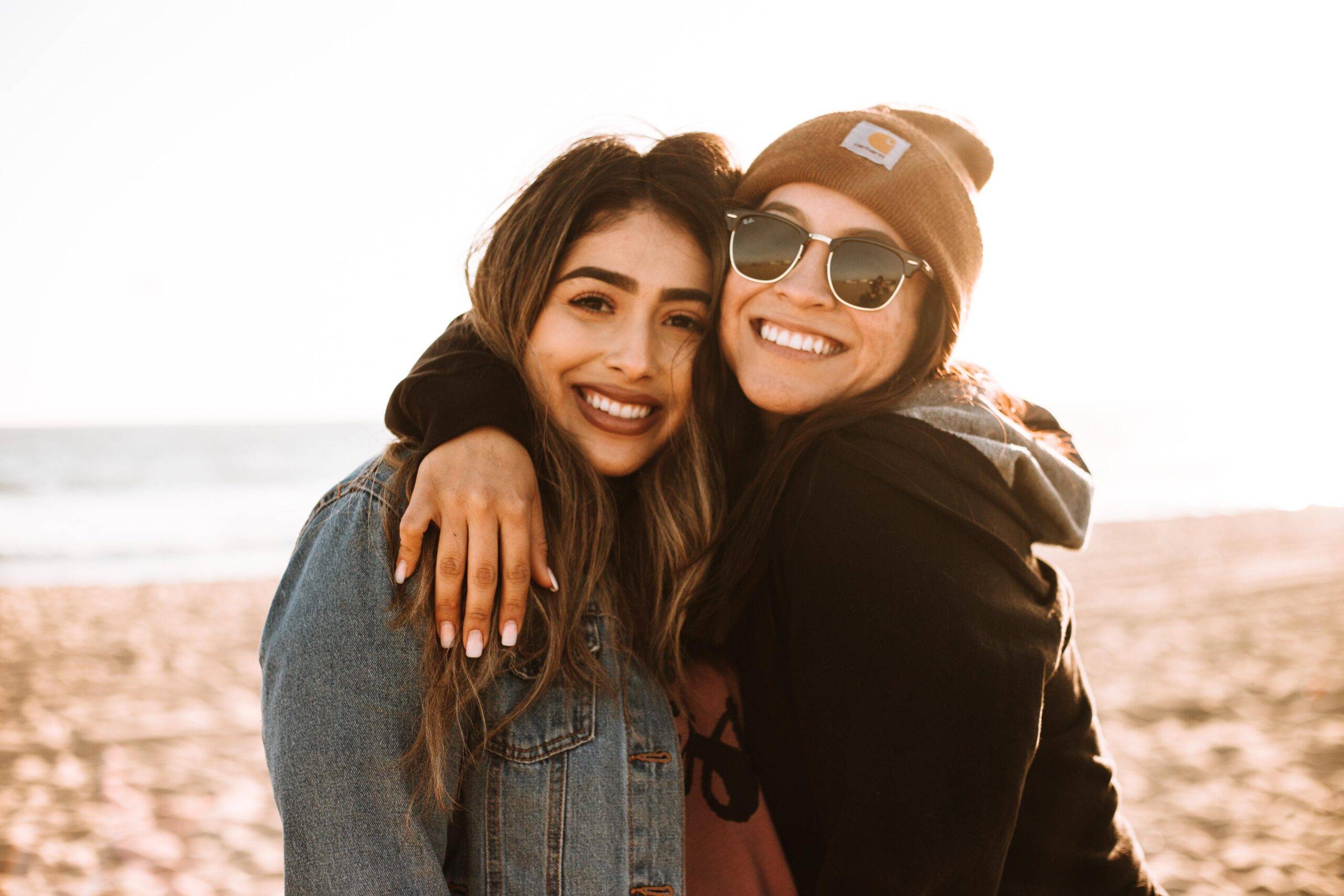 two women hugging and smiling
